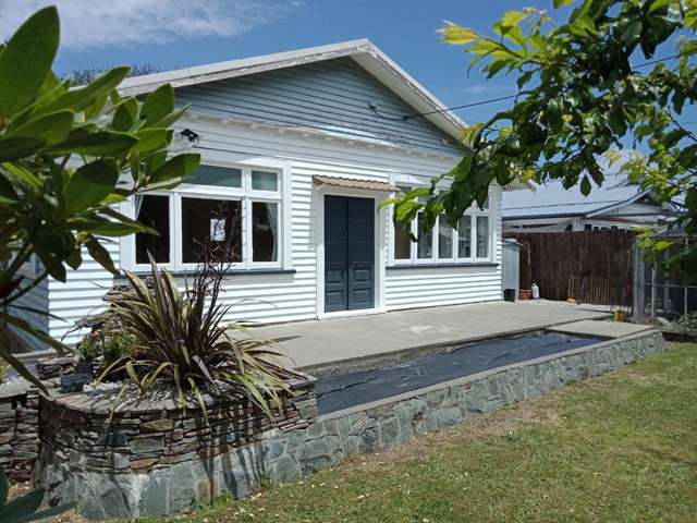 Introducing this cozy four-bedroom, two-bathroom home!