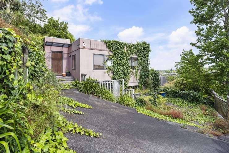 The colourful 133 West Harbour Drive, left, and the rundown 1/125 West Harbour Drive, both in Auckland's West Harbour, are up for grabs. Photo / Supplied