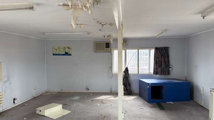 Eleven students from Trident High School, in Whakatāne, have spent the last eight months renovating an old smoko house. Pictured is tutor Hamish Galloway with some of the students. Photo / Boundless Vision and The Northern Group