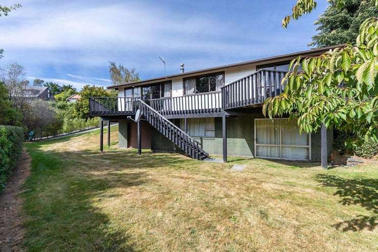 An overseas buyer holds the last original bach on the Kelvin Heights foreshore. He bought the property 38 years.  Picture / Supplied