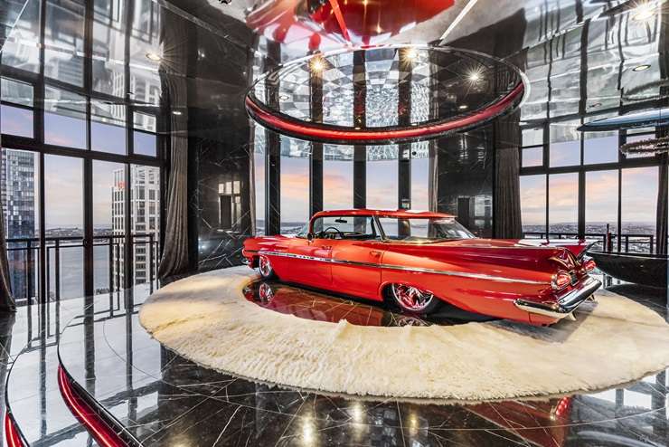 The Batman logo looms large in the luxury apartment at the top of the Metropolis tower in Auckland Central. Photo / Supplied