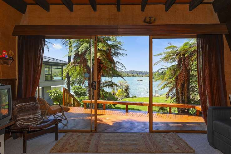 The quirky A-frame in a prime lakefront spot in Okawa Bay, Lake Rotoiti, is for sale for the first time. Photo / Supplied