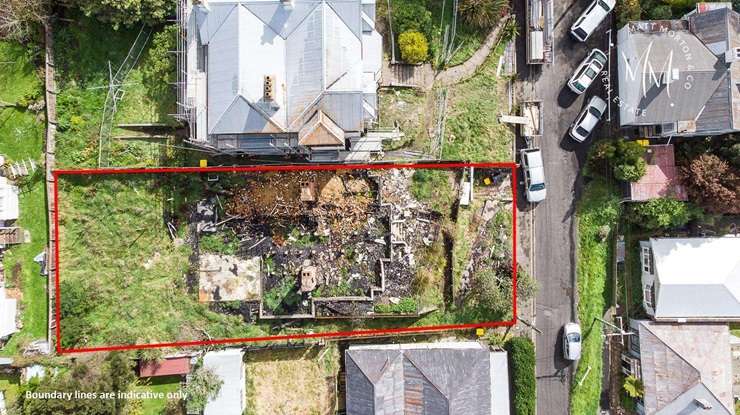 Fire consumes the former boarding house at 3 Phillips Street, in Kensington, Dunedin, in October 2023. Photo / Stephen Jaquiery