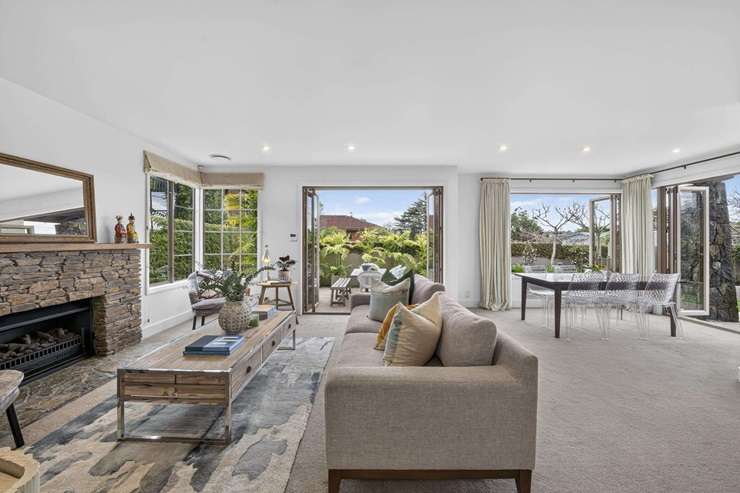 A family toughed it out over 220 bids to buy a plaster-clad home in Auckland's double grammar zone, on Brookland Place, in Remuera. Photo / Supplied