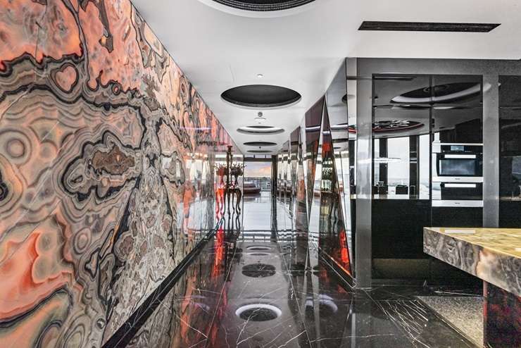 The Batman logo looms large in the luxury apartment at the top of the Metropolis tower in Auckland Central. Photo / Supplied