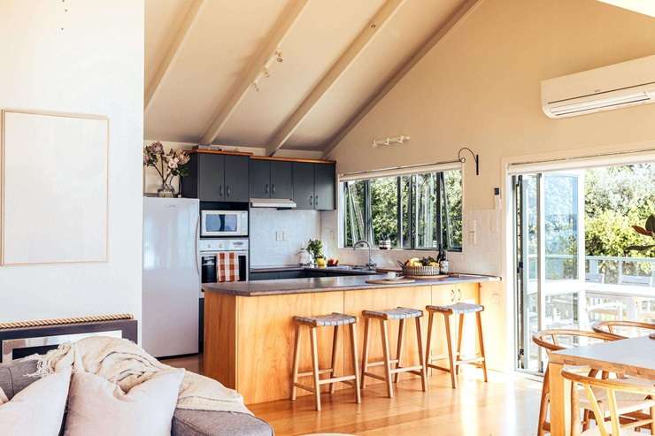 A beachfront property in Arran Bay with its own boatshed and mooring sold under the hammer for $2.765m. Photo / Supplied