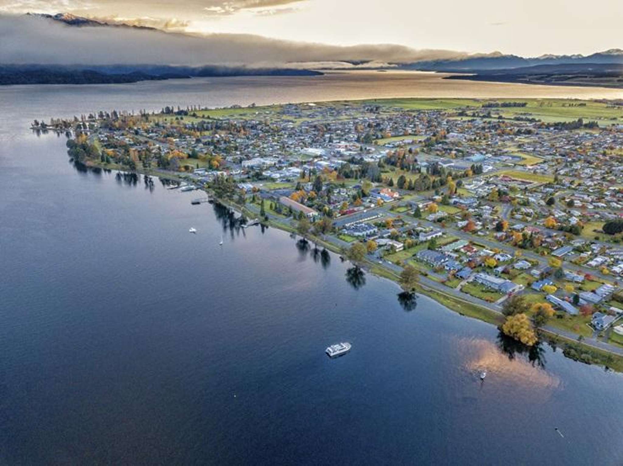 Like Queenstown but ‘normal’: Tiny lakeside town where houses are cheaper and buyers pay in cash