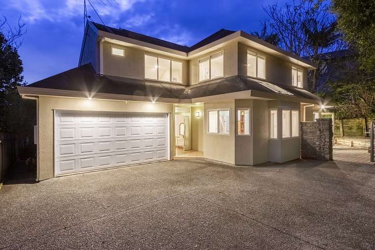 A four-bedroom house on Law Street, in Torbay, Auckland's North Shore, sold under the hammer for <img.566 million. Photo / Supplied