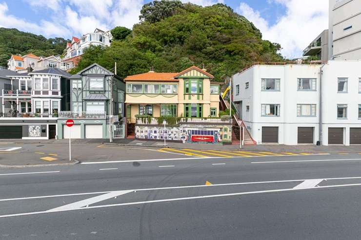 The villa at 186 Oriental Parade, in Oriental Bay, is for sale by negotiation. Owners Liz Aitken and Rob Morgan commissioned the eye-catching mural that faces the street. Photo / Supplied