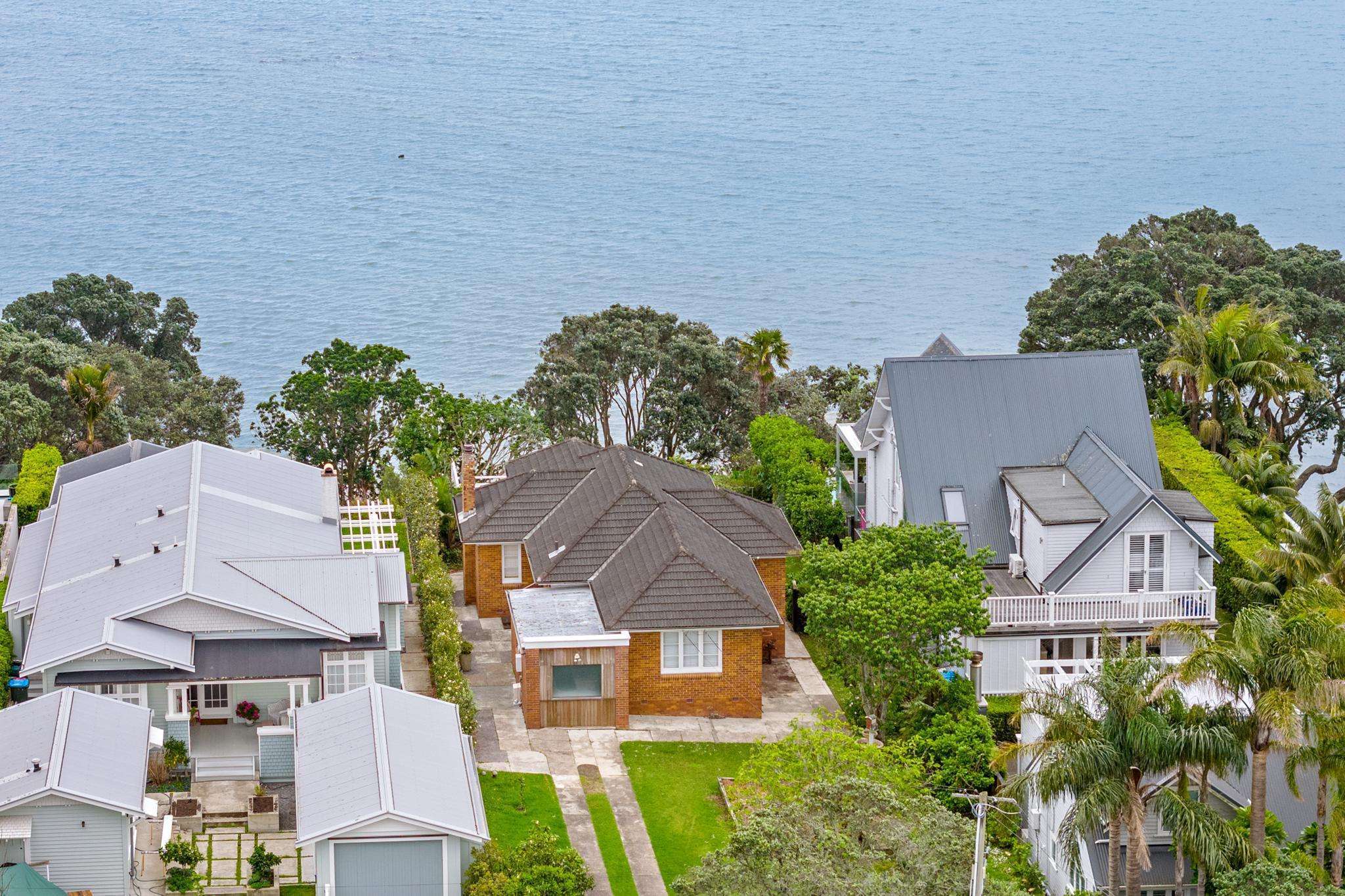 Modest brick-and-tile house on billionaire street sells for $8.6m
