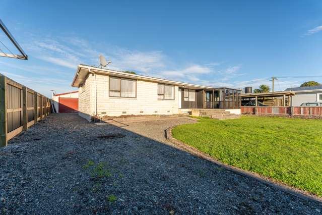 Sunny & Secure with Exceptional Garaging!