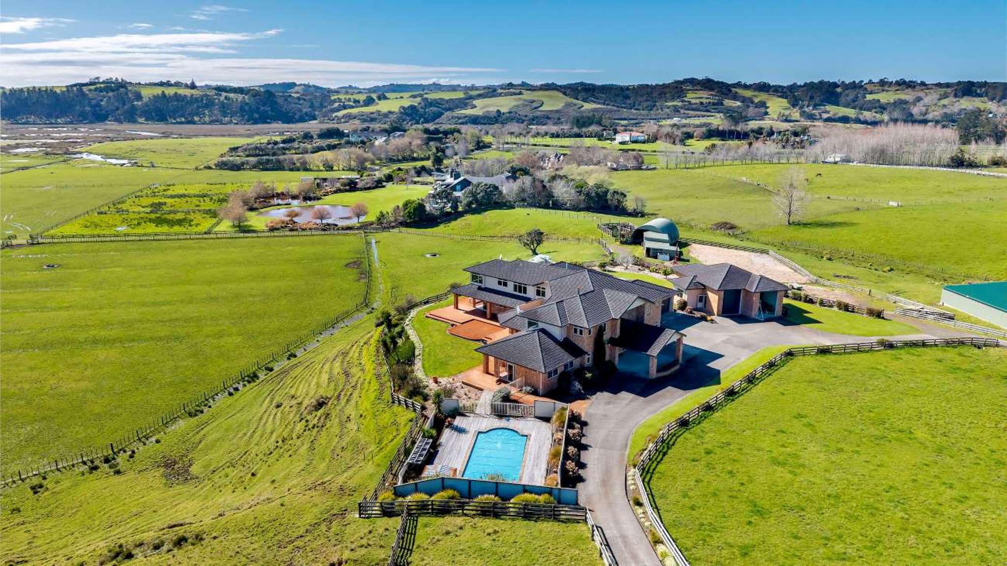 Grand waterfront estate built by owners’ sons and daughter hits the market