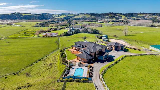 Grand waterfront estate built by owners’ sons and daughter hits the market