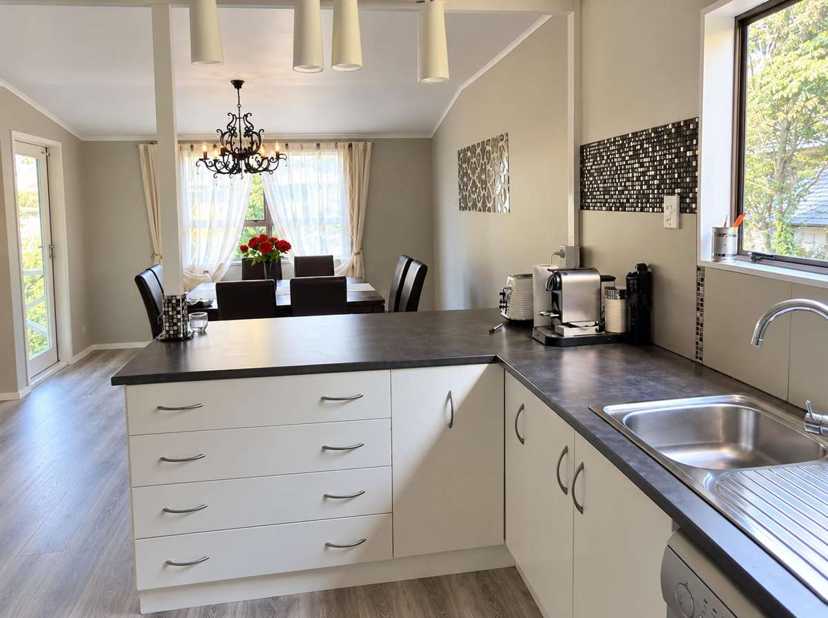 **Spacious Family Home with 5 Bedrooms Flexibility, Two Living Areas & Large Section** 5