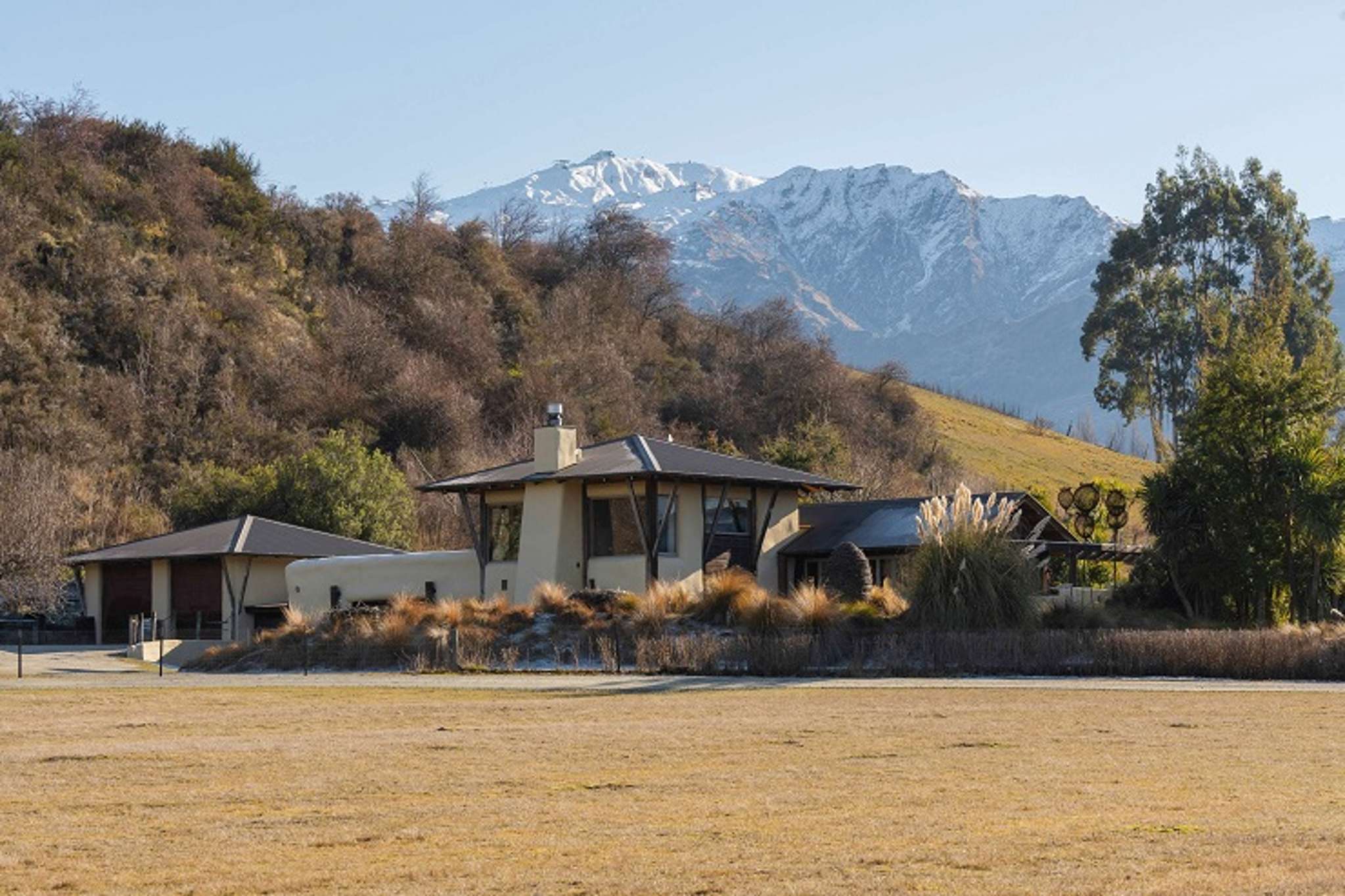 Artists selling their ‘curved, wonky and fun’ Queenstown cottage for $4.57m