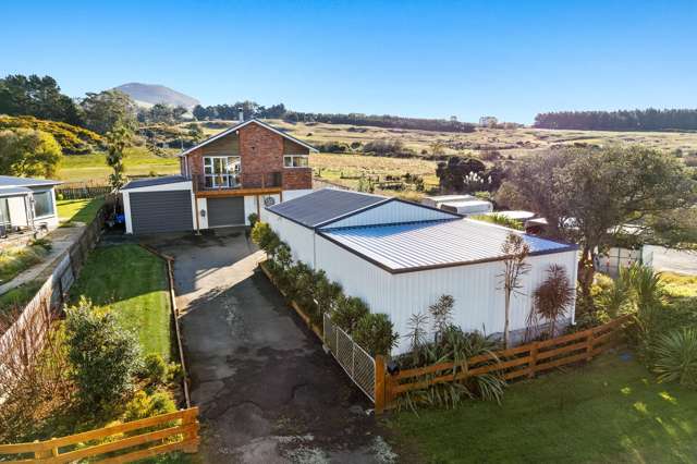 Not 1, not 2, but 3 Garages! Plus a Modern Home