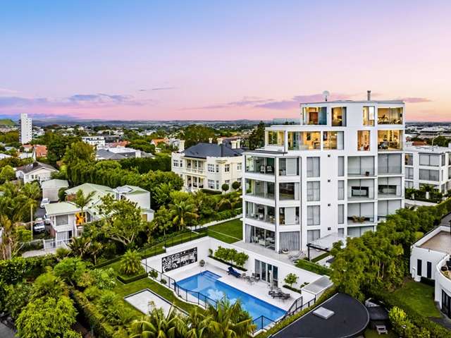 Car man's penthouse has a garage that’s bigger than most Kiwi homes