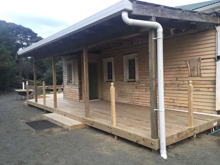 The original lighthouse keeper's cottage in Pouto, Kaipara, is up for grabs. Photo / Supplied