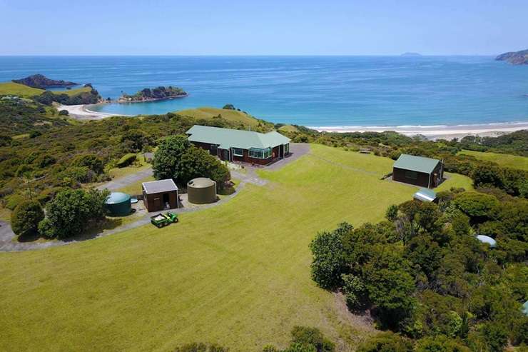 The run-down cottage on Blind Bay Road, on Great Barrier Island, was sold “as is, where is”. Photo / Supplied
