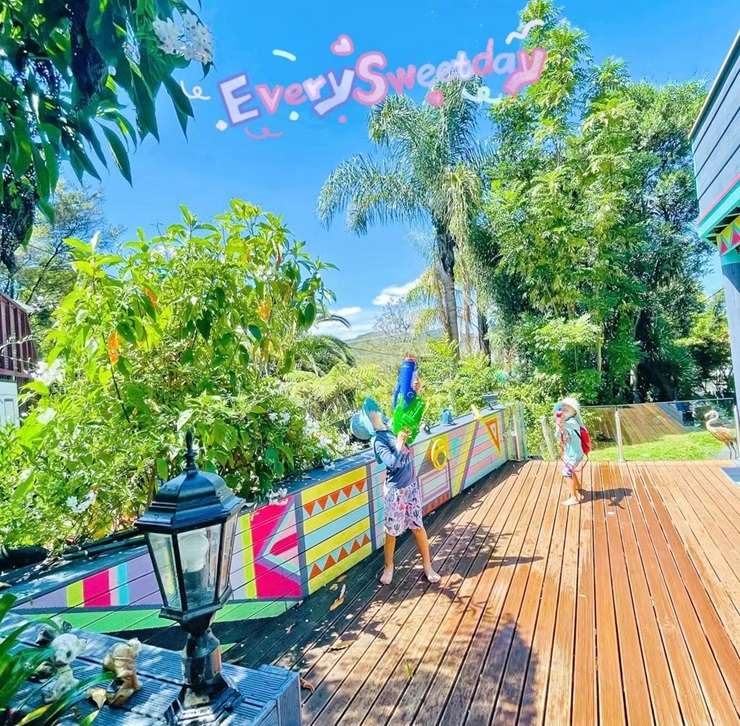 All things bright and beautiful: 221 Woodlands Park Road, in Auckland's Titirangi, heads to auction on April 18. Photo / Supplied