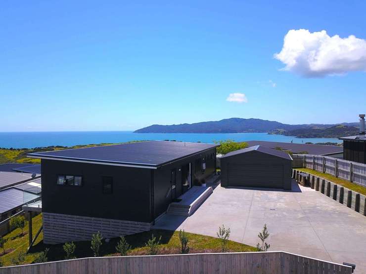 A three-bedroom bach-like home at 6 Sunset Heights, Cable Bay, Far North, is up for grabs. Photo / Supplied