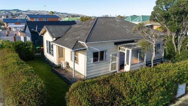 Potential Packed— 4 bedrooms plus garage