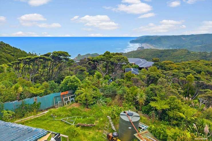 36 Piha Road seems to float above Piha's iconic coastline. It's on the market for $2.985 million. Photo / Supplied