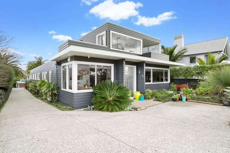 dark stained wood townhouse with open doors and wood deck  1/259 Jervois Road, Herne Bay, Auckland