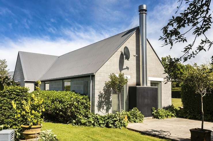 The two-bedroom property at 416 Bradleys Road, in Ohoka, was inspired by some of Canterbury's pioneering architects including Sir Miles Warren. Photo / Supplied