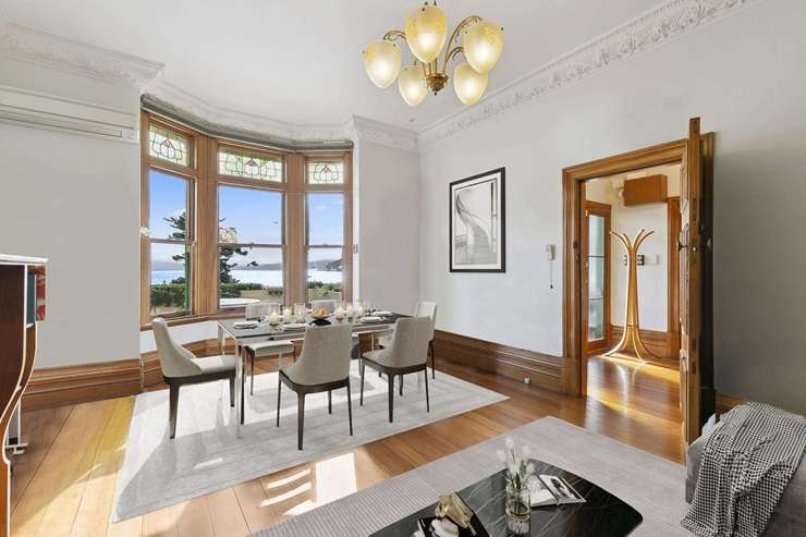 The villa at 186 Oriental Parade, in Oriental Bay, is for sale by negotiation. Owners Liz Aitken and Rob Morgan commissioned the eye-catching mural that faces the street. Photo / Supplied