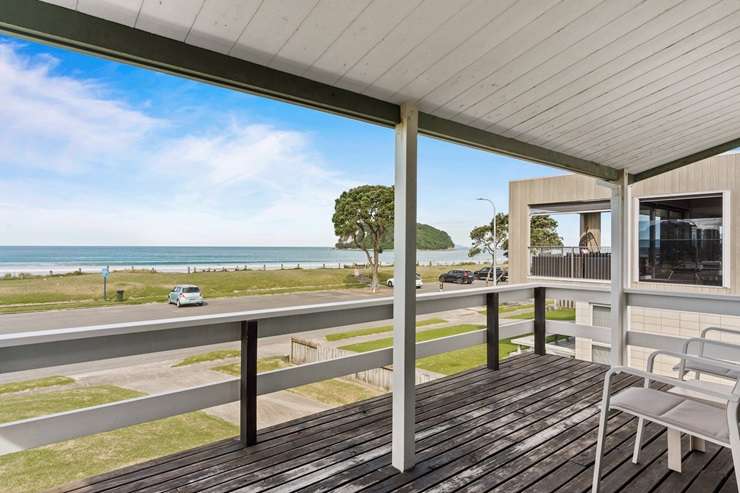 A four-bedroom home on Esplanade Drive, just across from Whangamata Beach, and the section behind it have sold after a deadline process. Photo / Supplied