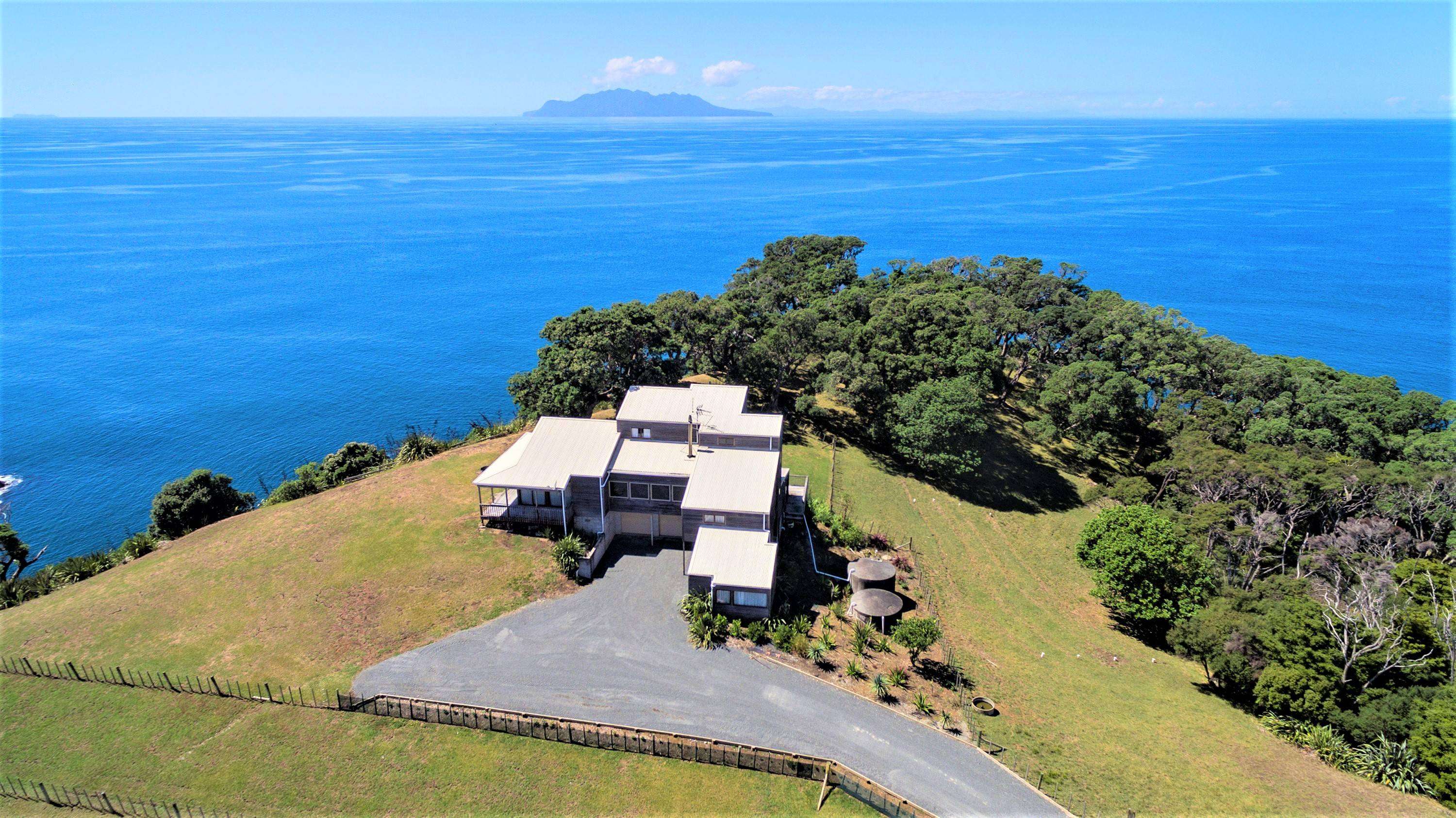 aerial view of orchards, paddocks and luxury houses overlooking harbour. 288 Point Wells Road, Point Wells on Whangateau harbour