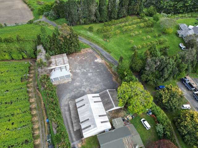 Large yard with office/storage buildings