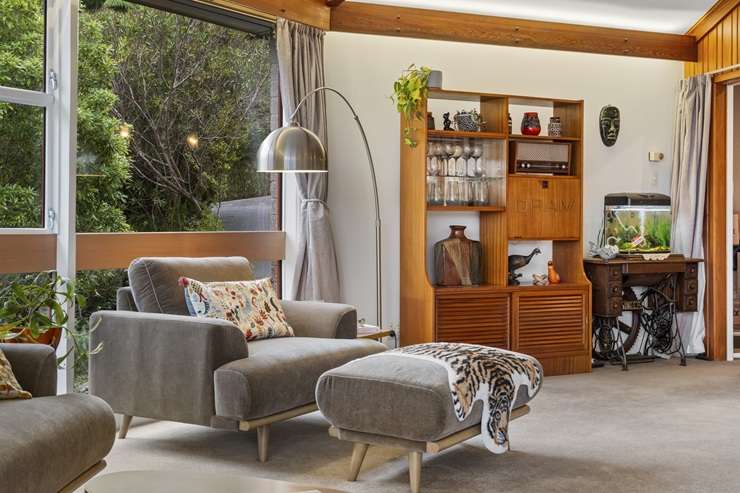 A young family has bought the mid-century house on Gurney Road, in Kelson, Lower Hutt, which looks as if a UFO has landed on the hill. Photo / Supplied