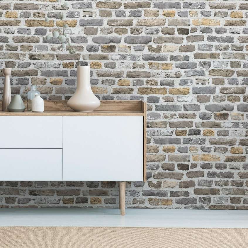 An intricate repurposed screen with ragged paint effect, used as a headboard, adds the suggestion of age and texture to this pared back colour palette. Walls and bedhead painted in Resene White Pointer, floor in Resene Colorwood Breathe Easy, bedside tabl