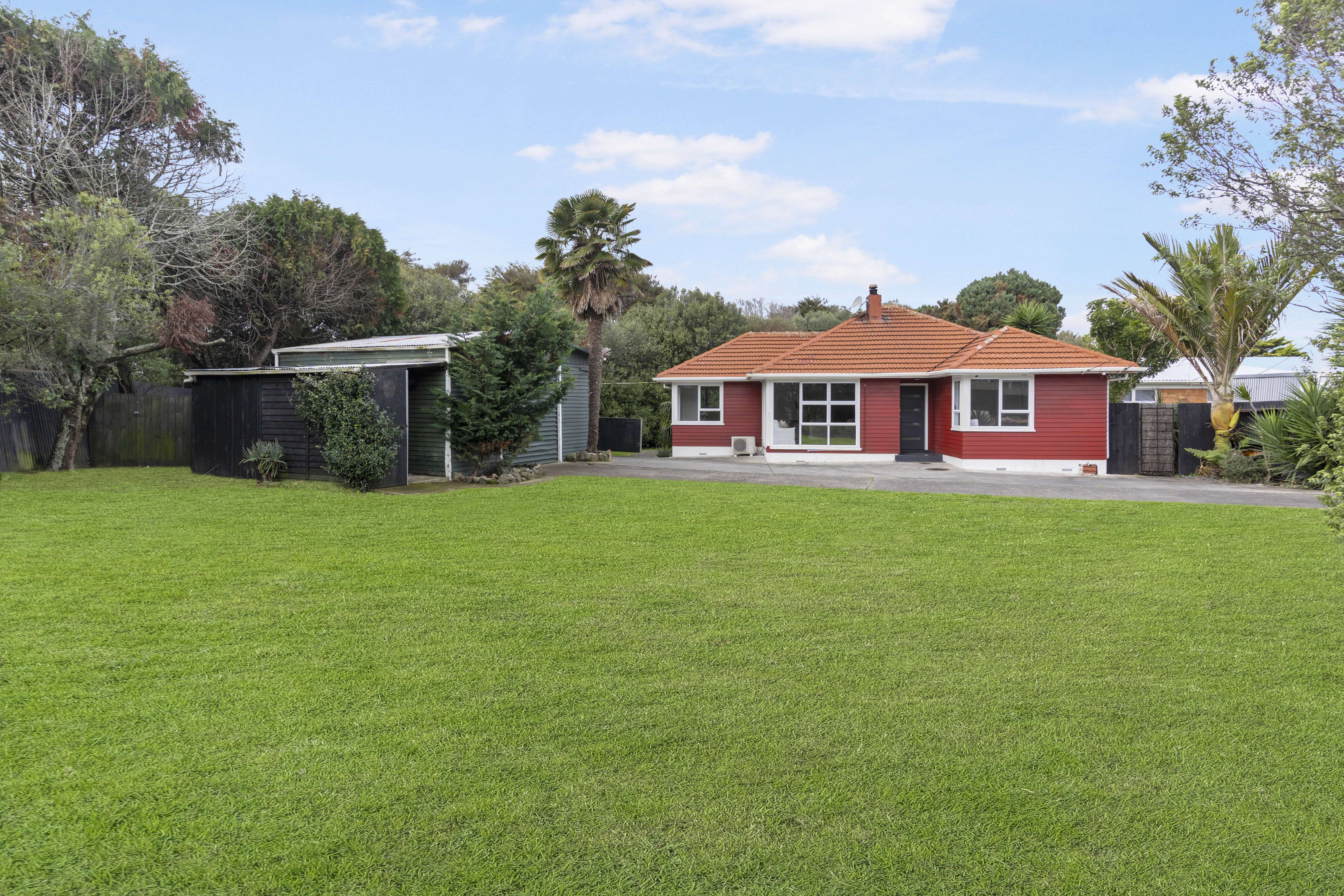 weatherboard house with sunset sky 188 Old Wairoa Road, Papatoetoe, South Auckland