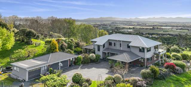 Two homes under one roof with land and views