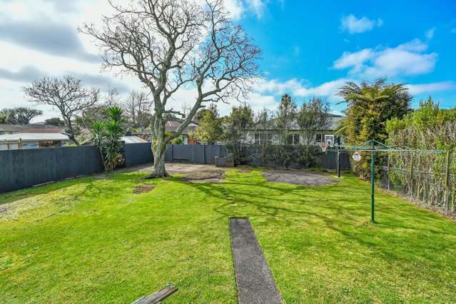 Brick, large backyard and living spaces