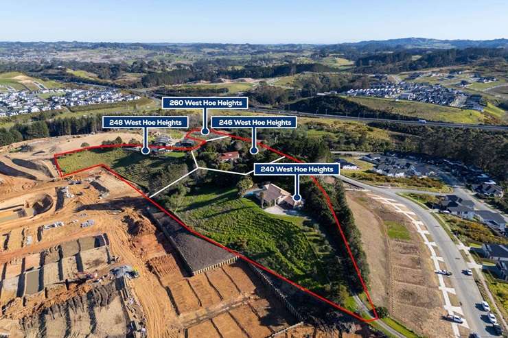 On the market for sale, with its three neighbours, is 240 West Hoe Heights, in Orewa. Earthworks for a housing development can be seen in the background. Photo / Supplied