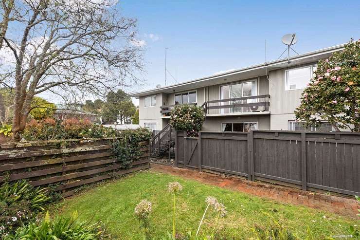 beige 1950s house with tile roof and green lawn  105 Parau Street, Mount Eden, Auckland