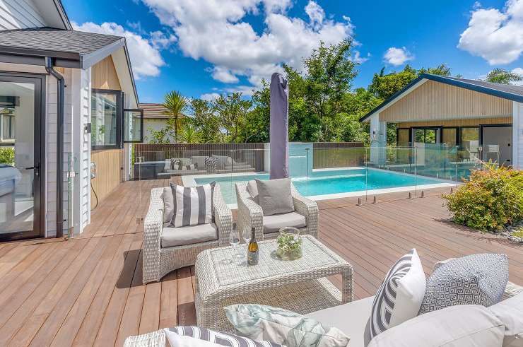 white and timber modern house with pool in front 8 Saint Elmo Rise, Shamrock Park, Dannemora, Auckland