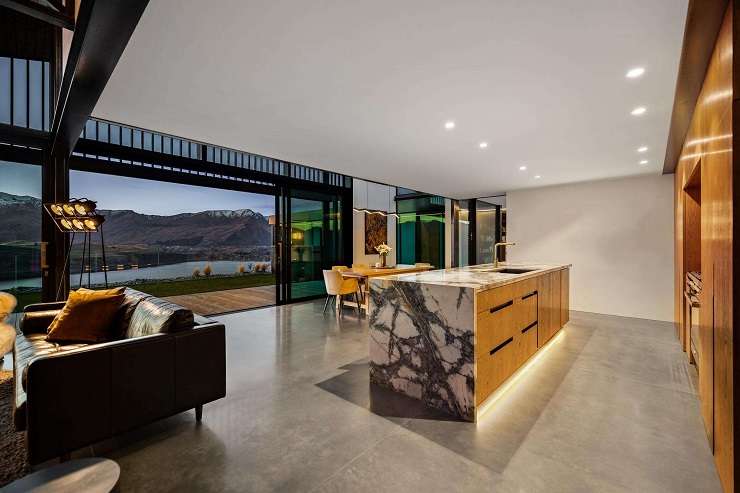 The architecturally designed home is in a much sought-after spot overlooking Lake Hayes, in Queenstown. Photo / Supplied