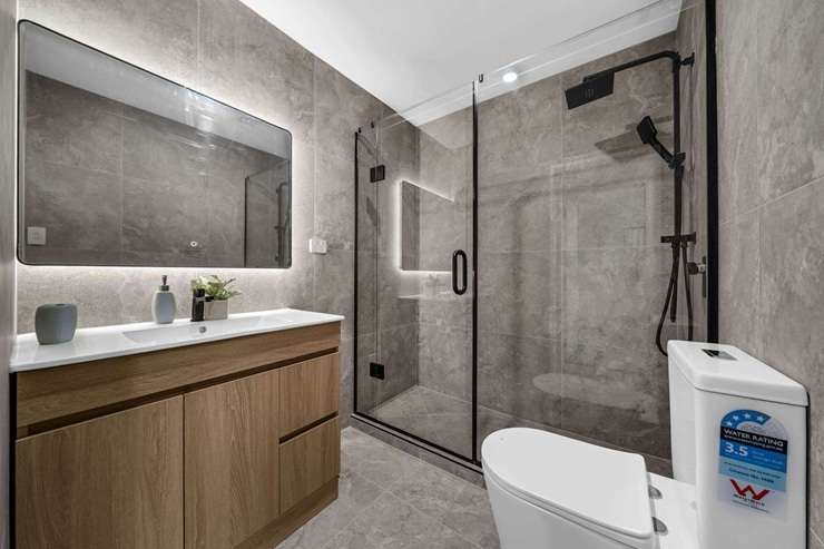 A four-bedroom townhouse on Raleigh Road, in Auckland’s Northcote, is back on the market after the vendor bought it at a court-ordered auction earlier this year. Photo / Supplied