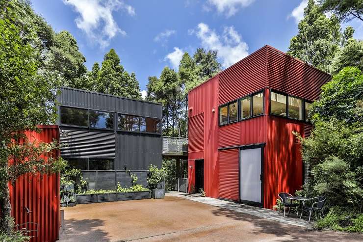 red corrogated iron house in bush 27 Longfellow Parade, Titirangi, Auckland