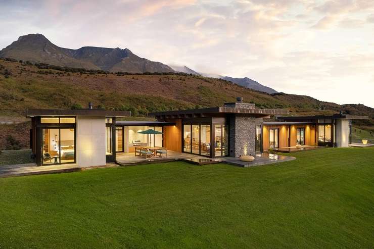 luxury concrete house with trees and mountain behind  10 Pinnacle Place, Queenstown