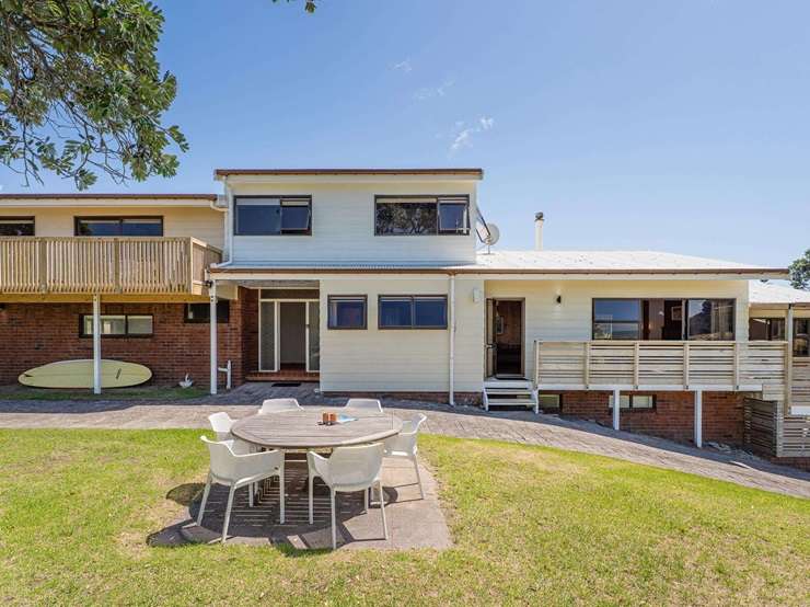 A seven-bedroom, two-bathroom home at 106 Pohutukawa Crescent has had its price slashed to $5.4m. Photo / Supplied