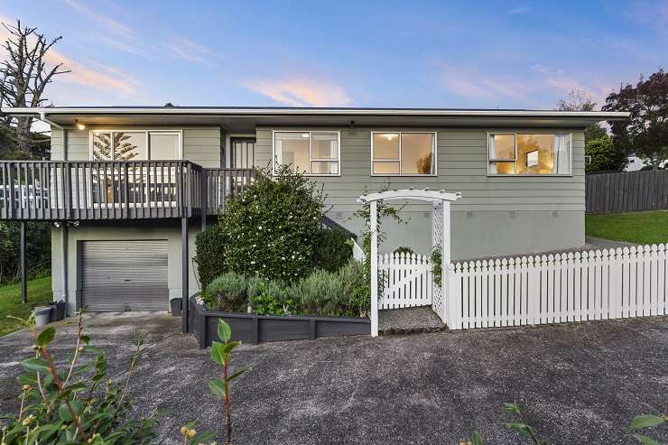 A four-bedroom house on Law Street, in Torbay, Auckland's North Shore, sold under the hammer for <img.566 million. Photo / Supplied