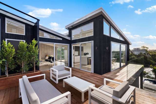 Architect-designed waterfront home with city views up for auction