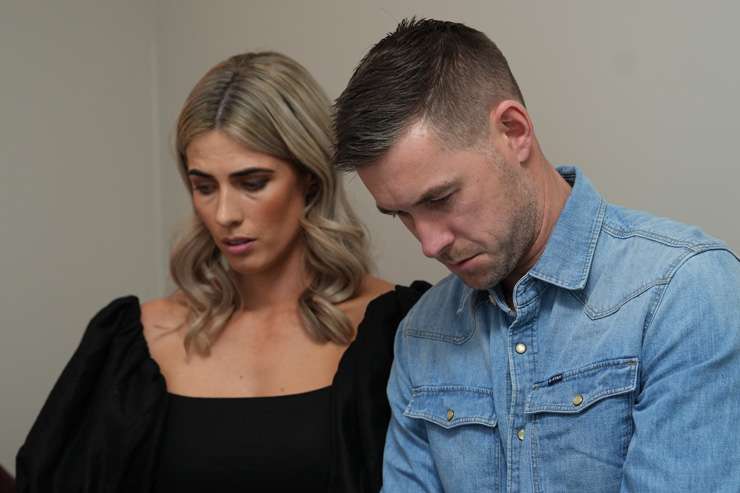 Stacy and Adam Middleton look upset as their house fails to sell under the hammer. Photo / Discovery