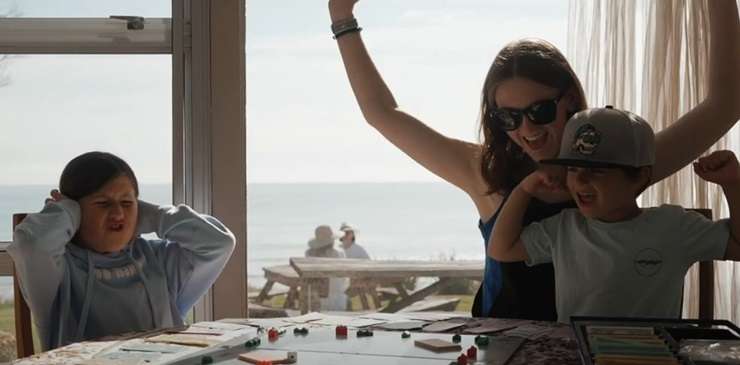 Listing agent Kay Ganley's mum Judy and her granddaughter Georgia appear in the marketing video for the 1950s beachfront bach on Oceanbeach Road, in Mount Maunganui. Photo / Supplied